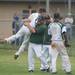 Huron's Bobby Knutilla and head coach Terry Bigham embrace after defeating Skyline in the district finals, Saturday, June 1.
Courtney Sacco I AnnArbor.com 